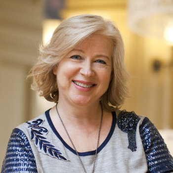 Close up facial portrait of a mature cheerful woman