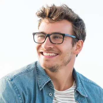 Handsome man smiling at the beach