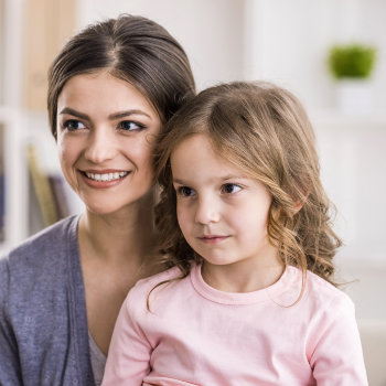 Mother with a little daughter are smiling