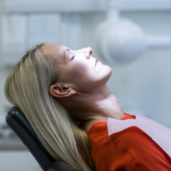 Woman relaxing on dentist chair