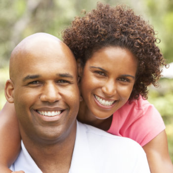 Young Couple Relaxing In Garden