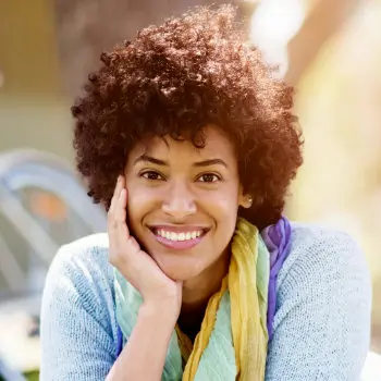 cheerful african american woman holding her cheek 1