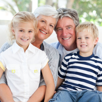 grandparents with grandchildren look at the camera