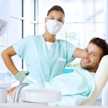 patient smiling happy after dental checkup