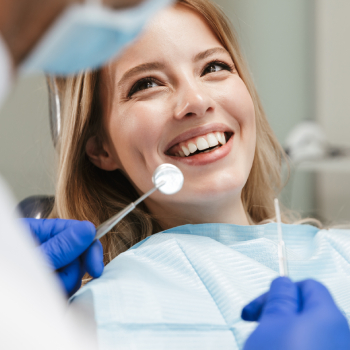 pretty young woman sitting in dental chair