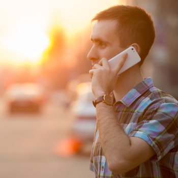 young man using smartphone making a call talking