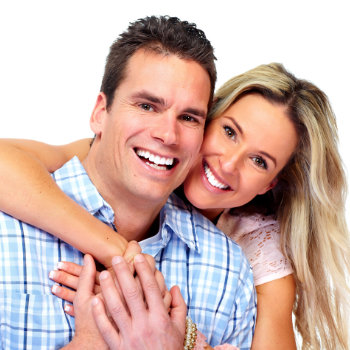 smiling couple hugging on a white background