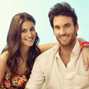 young beautiful spanish couple smiling