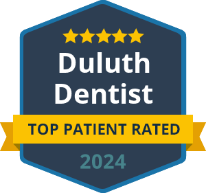 Badge reading "Duluth Dentist, Top Patient Rated 2024" with five stars at the top.
