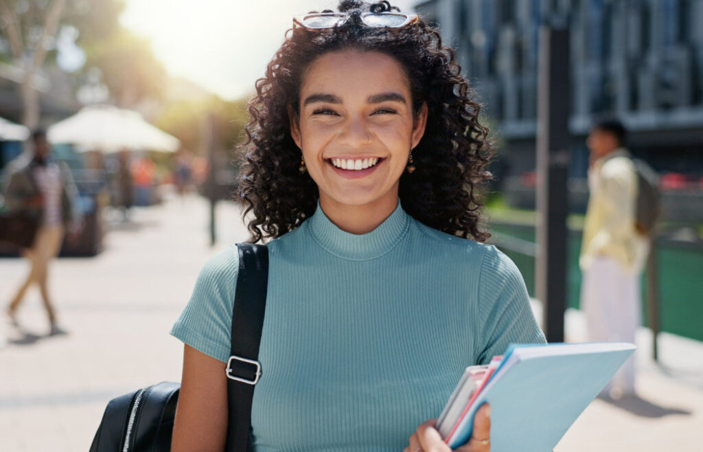 Young woman smiling outdoors
