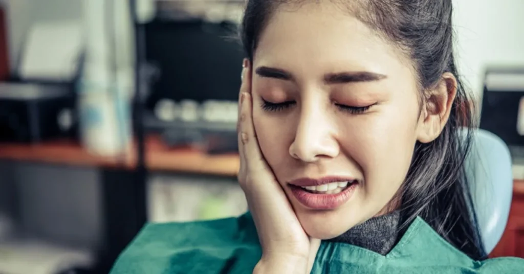 Broken Tooth Pain Relief in Duluth: Cost, Treatment Options, and What to Do First 4 Patient in dental chair with tooth pain needing urgent treatment help