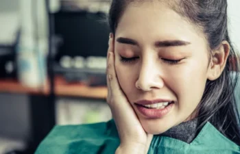 Patient in dental chair with tooth pain needing urgent treatment help