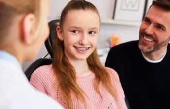 Family Dental Care Duluth teen smiling during dental checkup visit