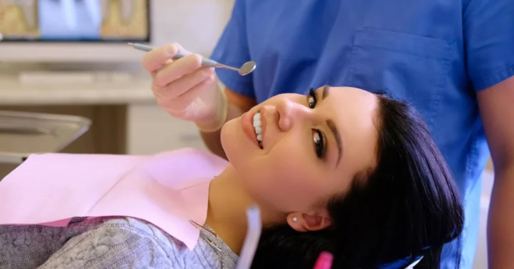 Patient smiling during dental checkup before implant treatment