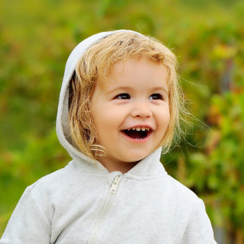 Pediatric DentistryDuluth child laughing in dental care visit