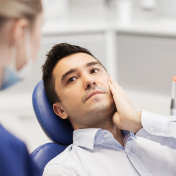 Tooth Pain Relief man in dental chair Emergency Dental CareDuluth