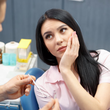 Dental visit woman in chair Duluth Dental Studio care