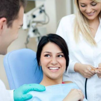 Dentist consulting with a patient