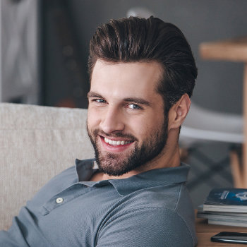 Smiling handsome businessman Duluth Dental Studio patient