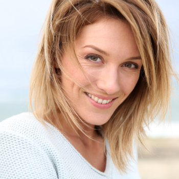 Mature blonde woman smiling Duluth Dental Studio patient