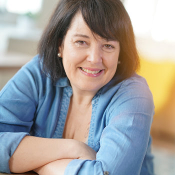 Mature brunette woman smiling Duluth Dental Studio care