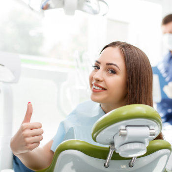 Complete Mouth Dental ImplantsDuluth happy patient smile chair
