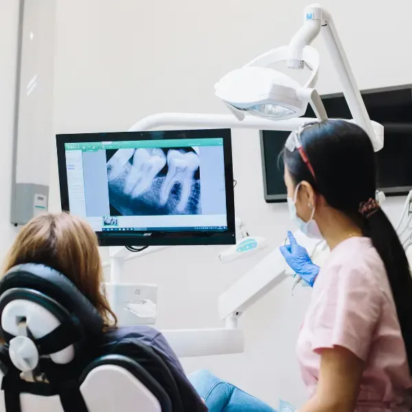 Dentist consulting with a patient